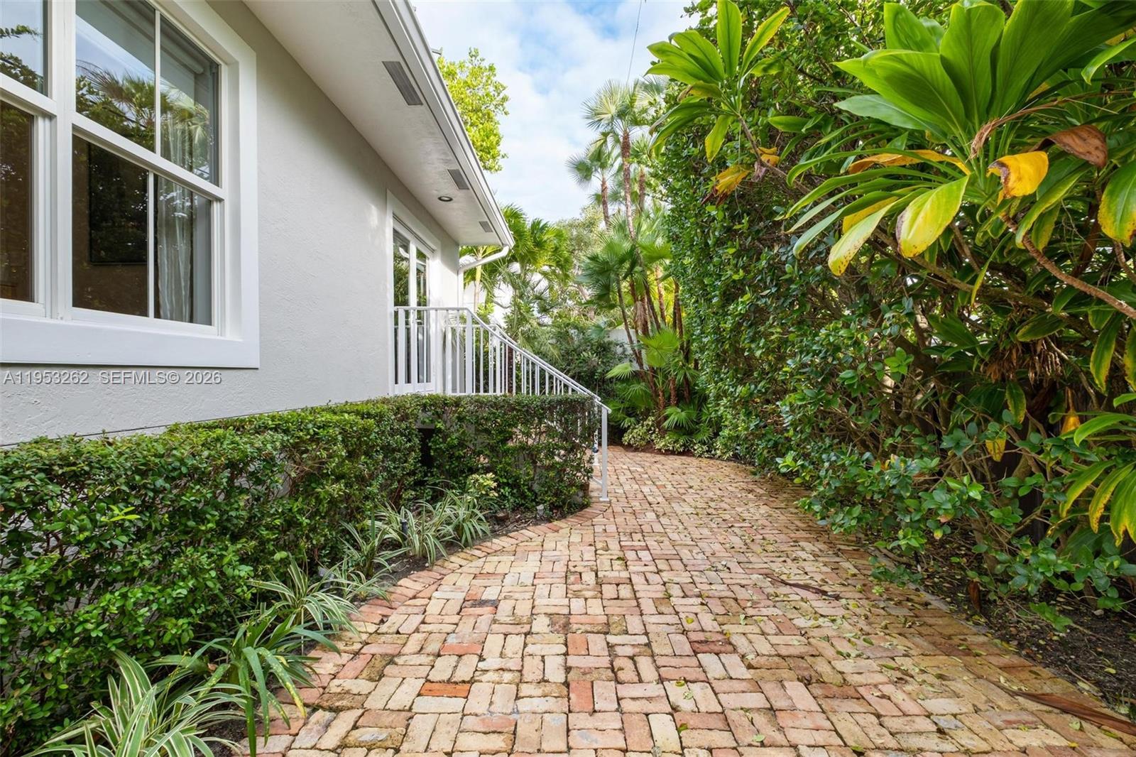 164 West Mashta Drive Key Biscayne, FL 33149 - Photo 31 of 34 a view of a pathway with a house
