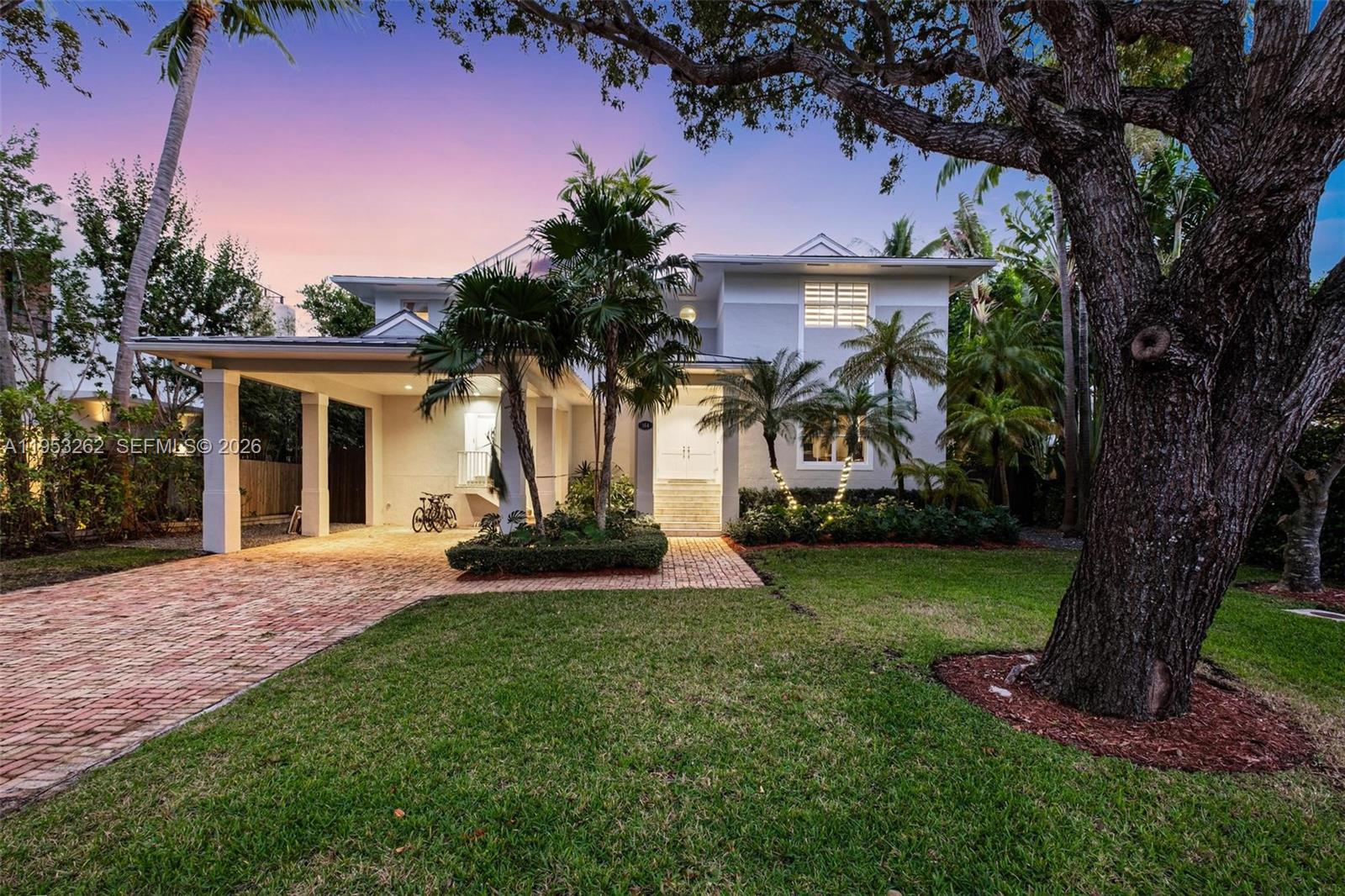 164 West Mashta Drive Key Biscayne, FL 33149 - Photo 32 of 34 front view of a house with a yard