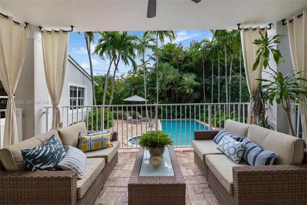 a view of a patio with couches table and chairs
