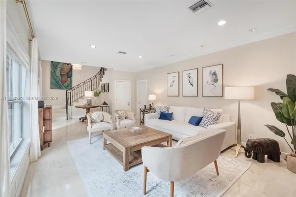 a living room with furniture and a couch
