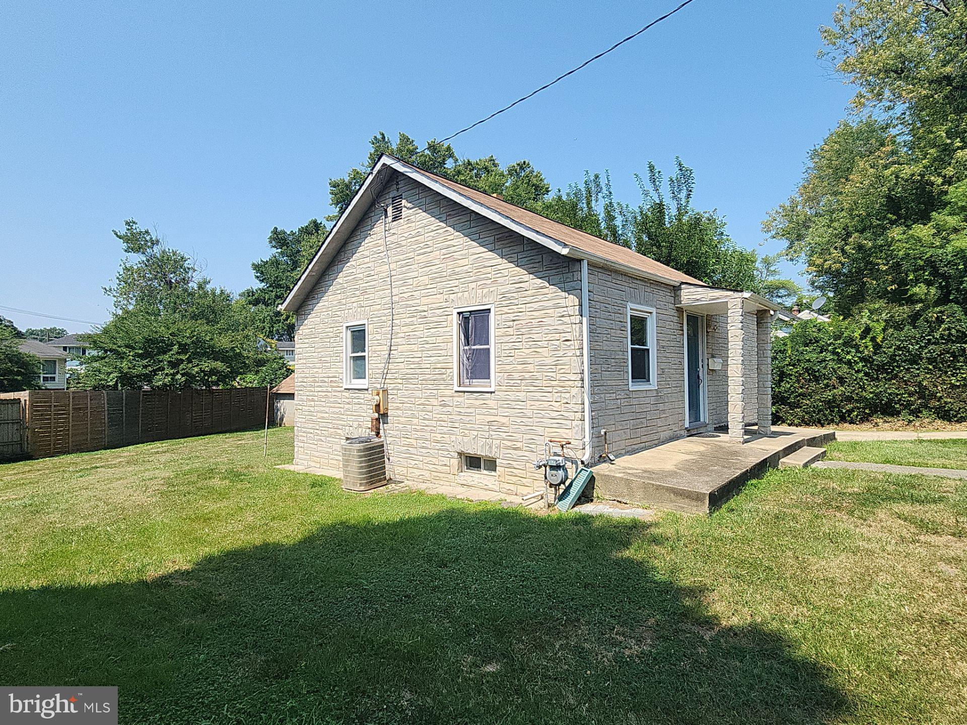 12024 Veirs Mill Road Silver Spring, MD 20906 - Photo 21 of 22 a view of a house with a yard and a garden