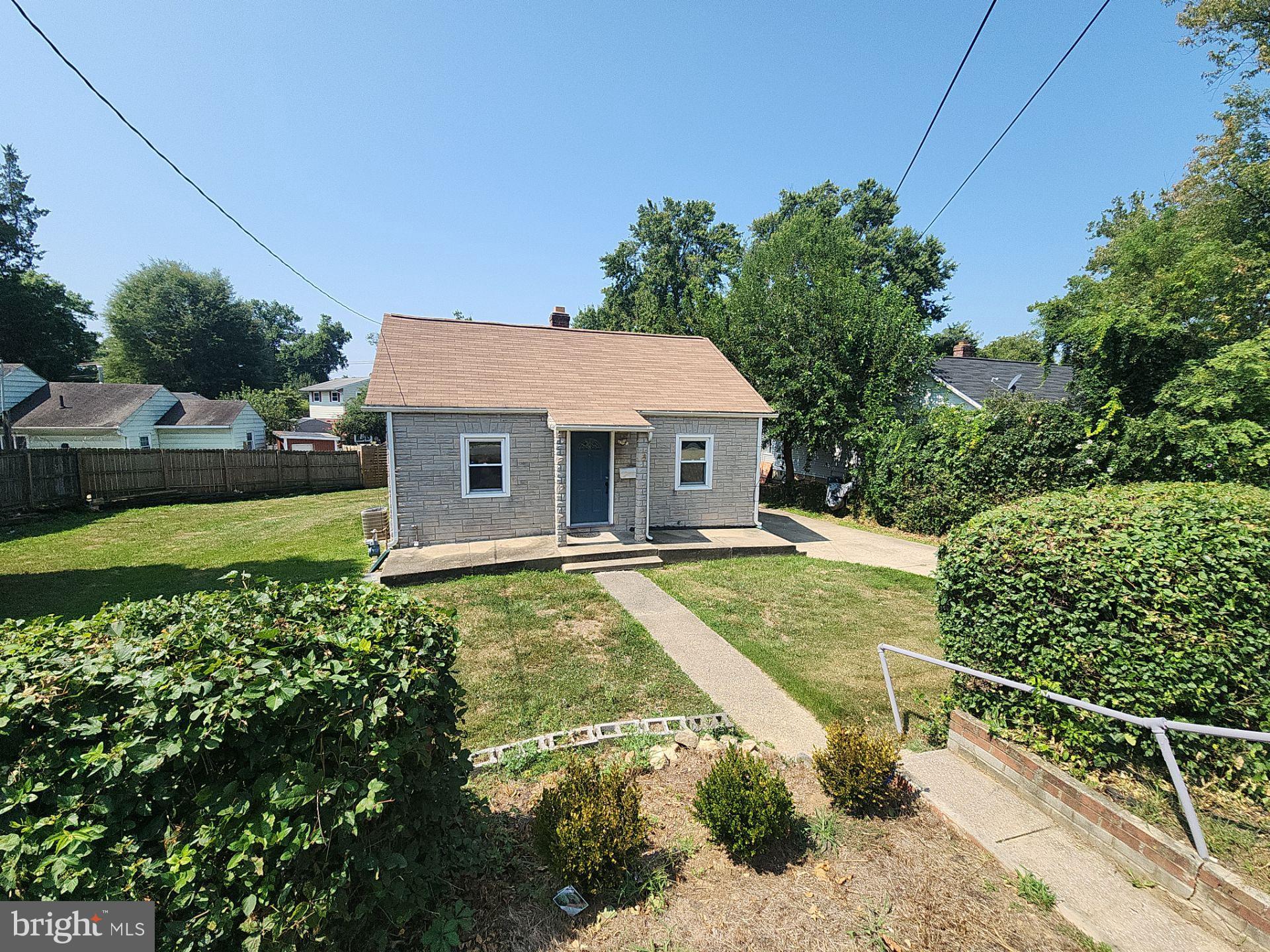 12024 Veirs Mill Road Silver Spring, MD 20906 - Photo 4 of 22 a aerial view of a house with swimming pool and next to a yard