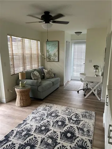 a living room with furniture and a window