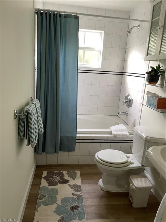 1471 Mandarin Road Naples, FL 34102 - Photo 18 of 28 a bathroom with a toilet and a shower