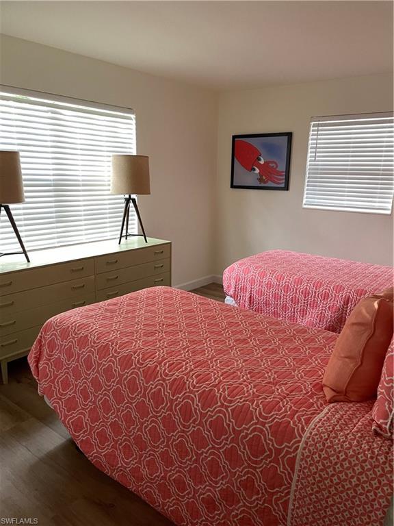 1471 Mandarin Road Naples, FL 34102 - Photo 19 of 28 a bedroom with a bed and window