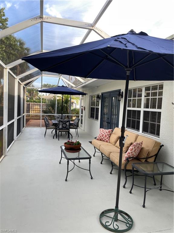 1471 Mandarin Road Naples, FL 34102 - Photo 28 of 28 a view of a chairs and tables in the patio
