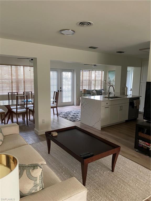 1471 Mandarin Road Naples, FL 34102 - Photo 9 of 28 a living room with furniture a rug and a large window