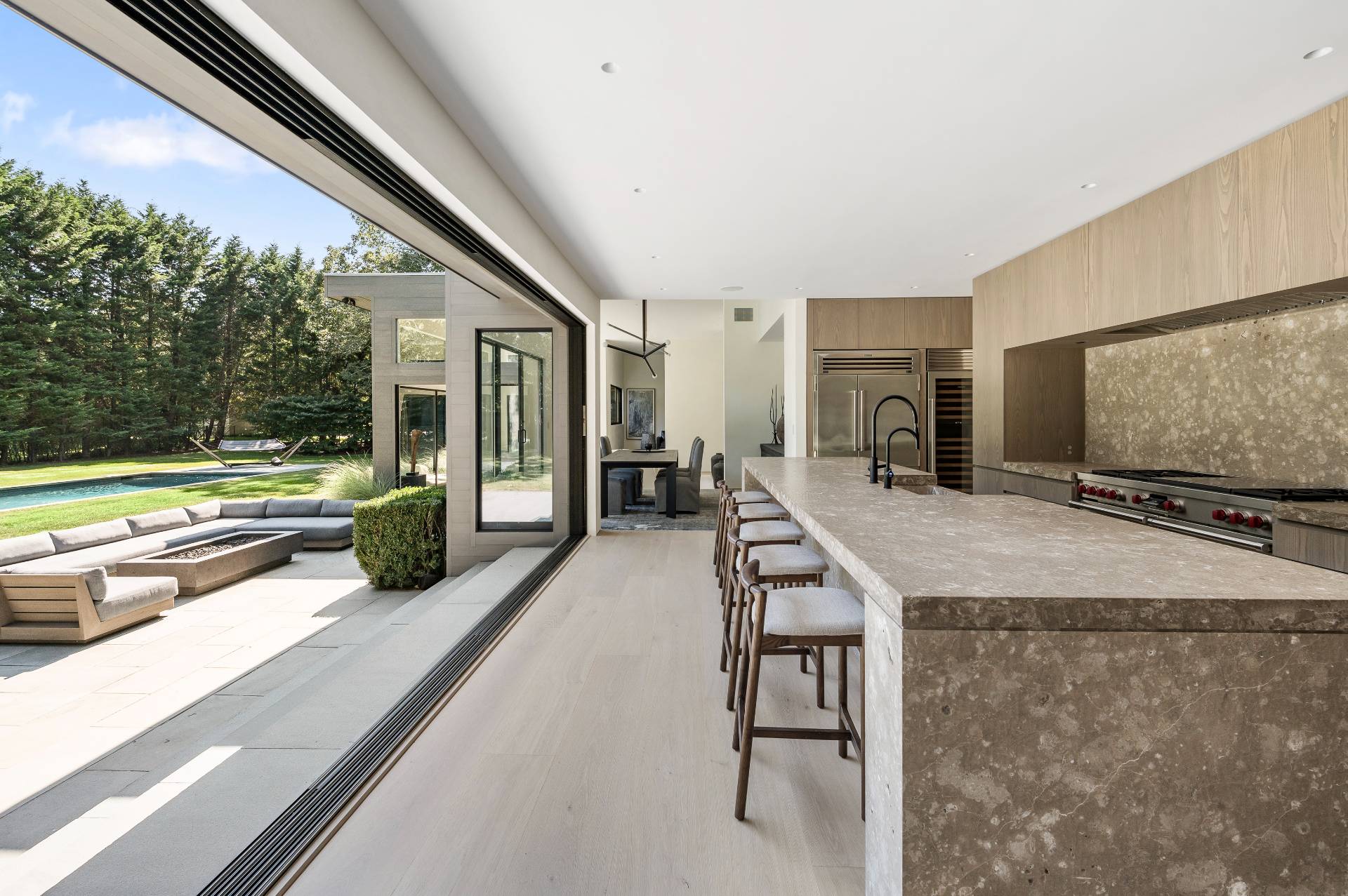311 Georgica Road East Hampton, NY 11937 - Photo 15 of 41 a kitchen with stainless steel appliances granite countertop a refrigerator and a stove