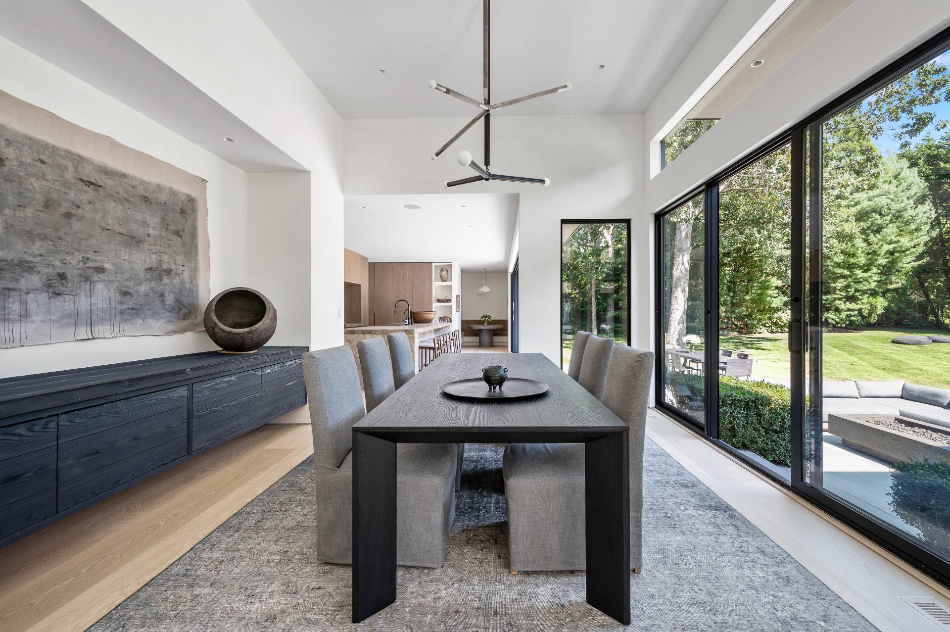 311 Georgica Road East Hampton, NY 11937 - Photo 16 of 41 a view of a dining room with furniture window and wooden floor