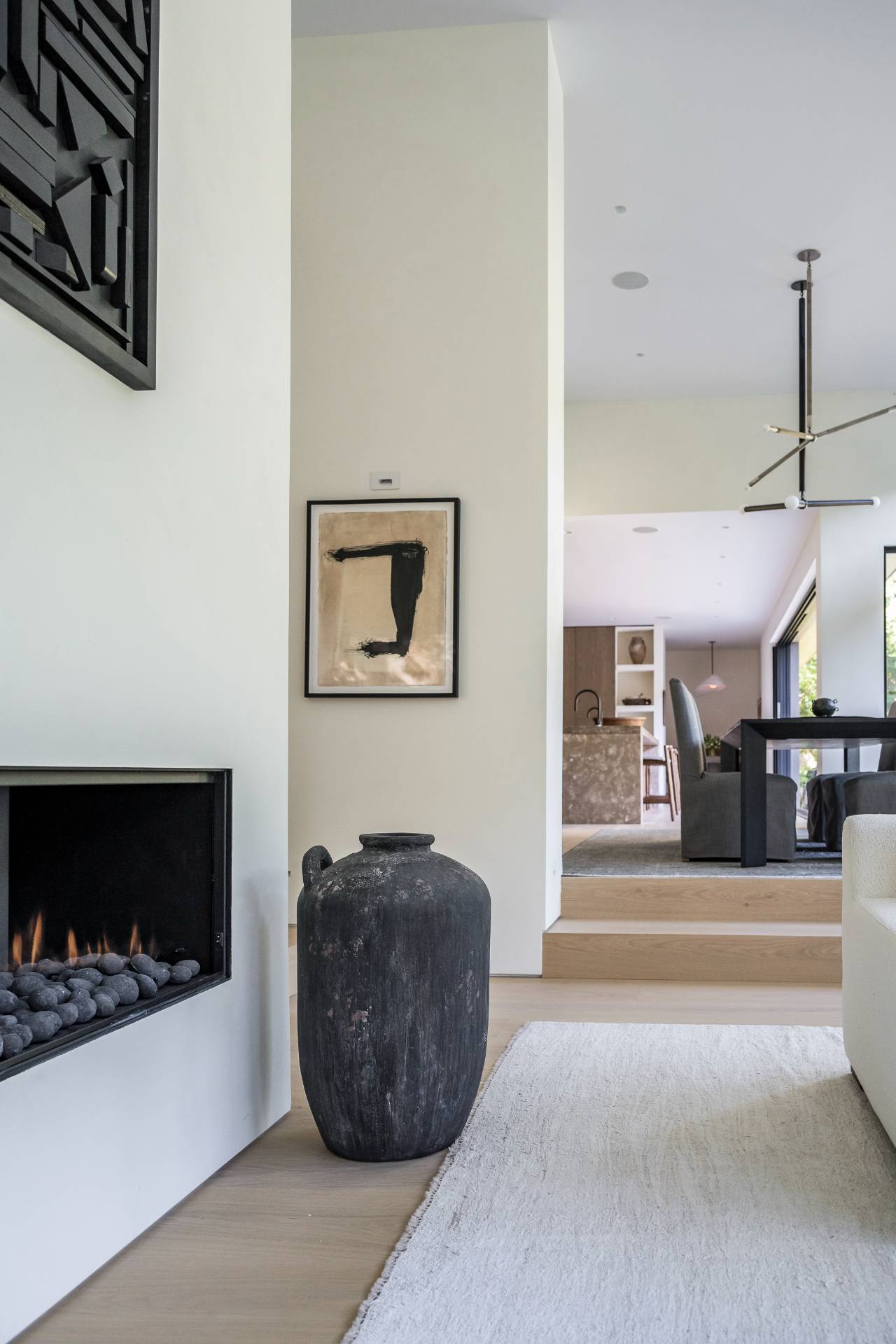 311 Georgica Road East Hampton, NY 11937 - Photo 21 of 41 a living room with furniture a flat screen tv and kitchen view