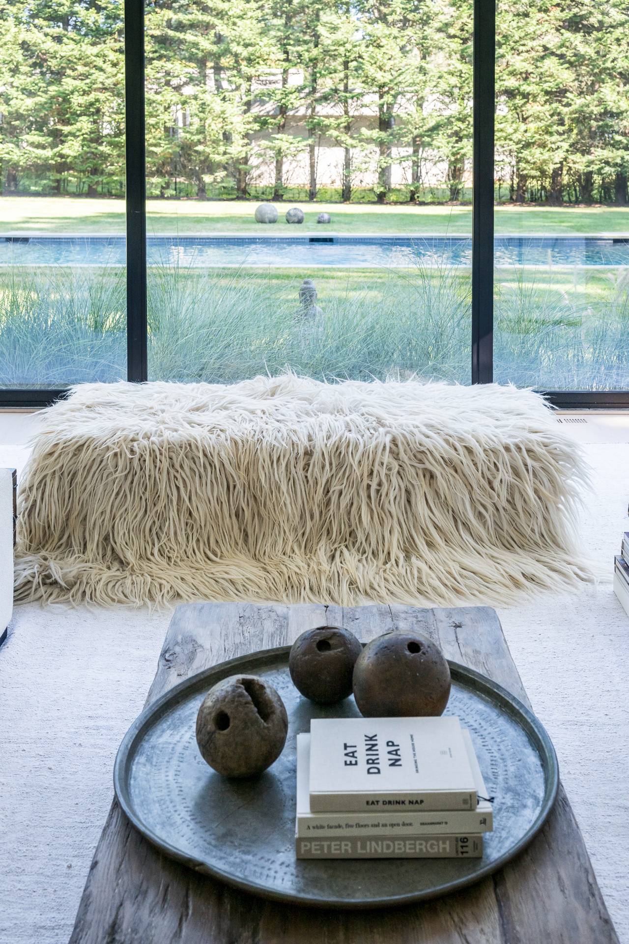 311 Georgica Road East Hampton, NY 11937 - Photo 24 of 41 a bed sitting in a bedroom next to a large window