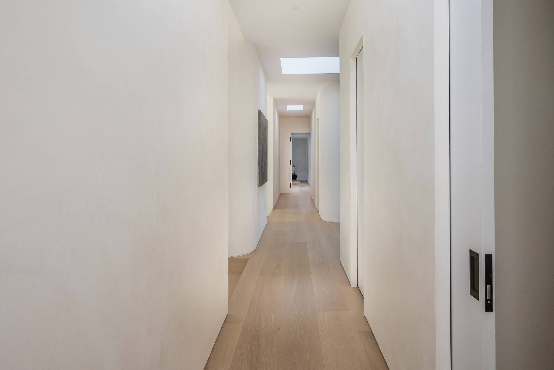 311 Georgica Road East Hampton, NY 11937 - Photo 27 of 41 a view of a hallway with wooden floor