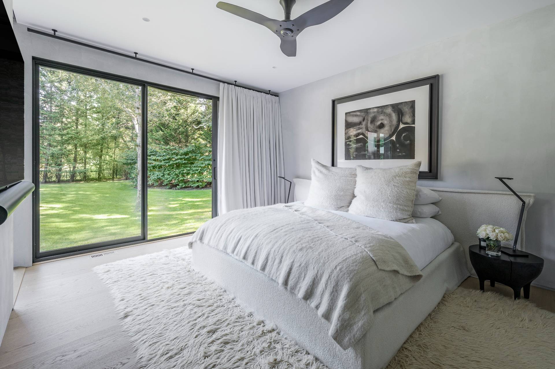 311 Georgica Road East Hampton, NY 11937 - Photo 28 of 41 a bedroom with a bed and a large window