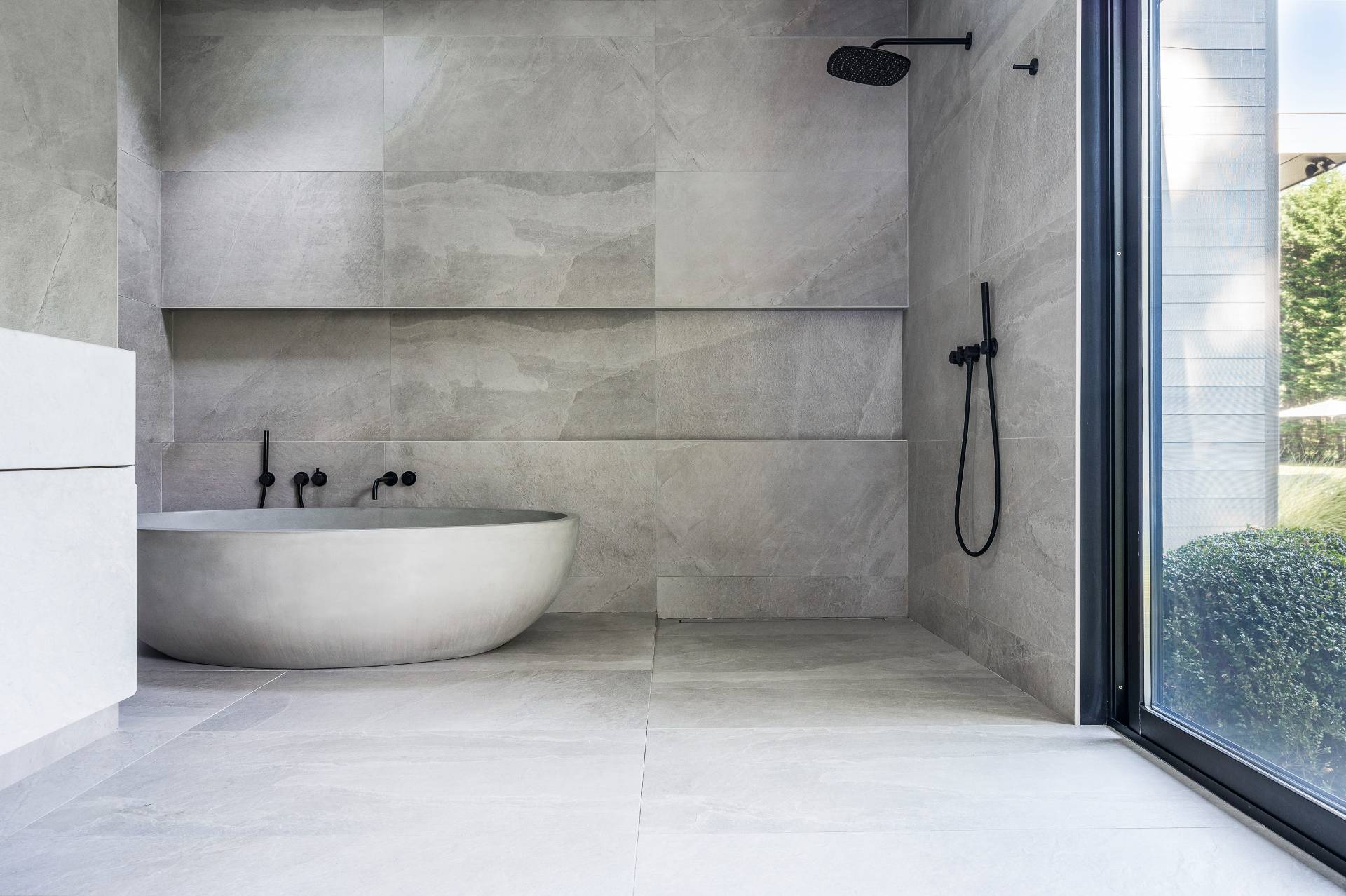 311 Georgica Road East Hampton, NY 11937 - Photo 29 of 41 a white tub sitting next to a shower