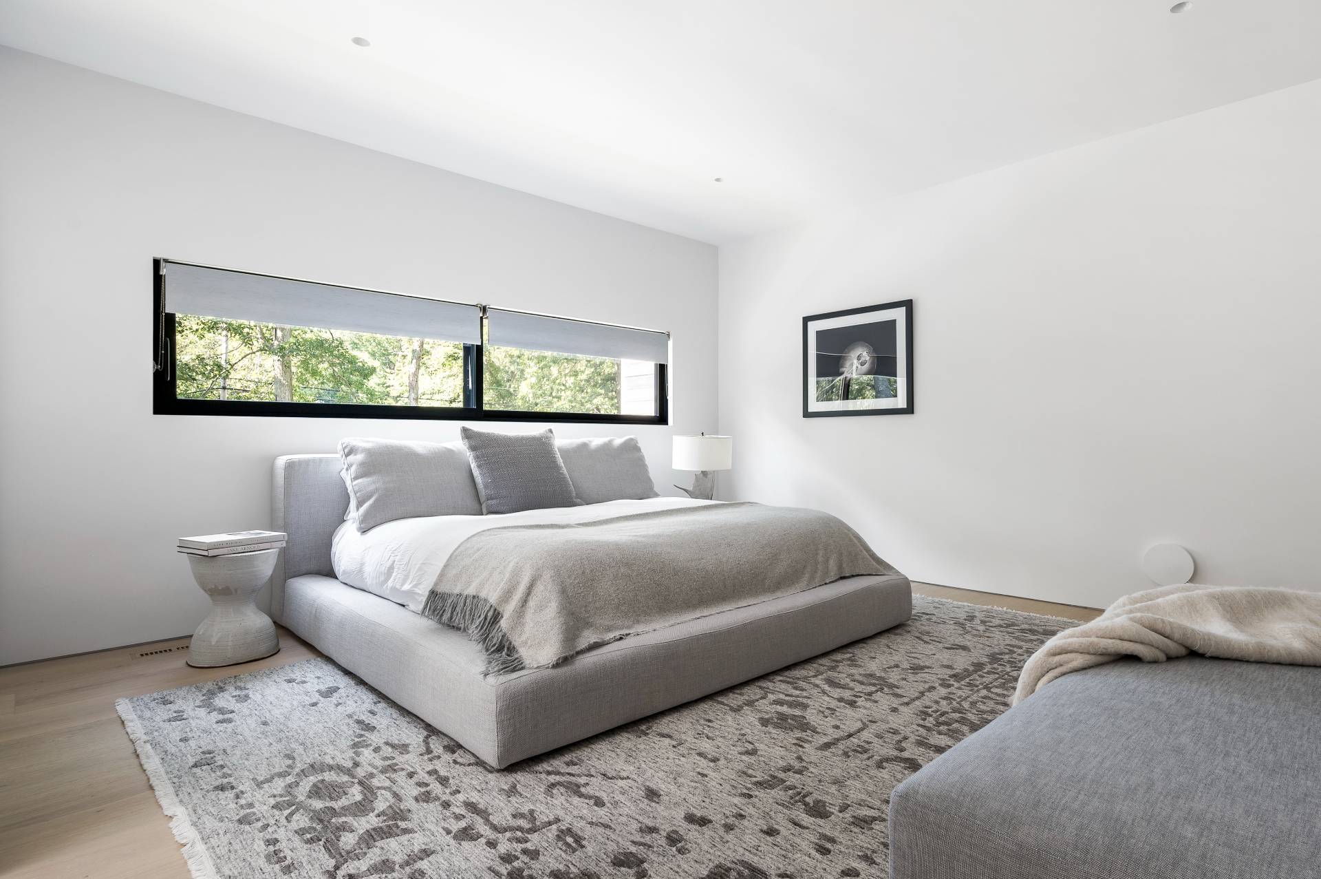 311 Georgica Road East Hampton, NY 11937 - Photo 34 of 41 a bedroom with a bed and a couch