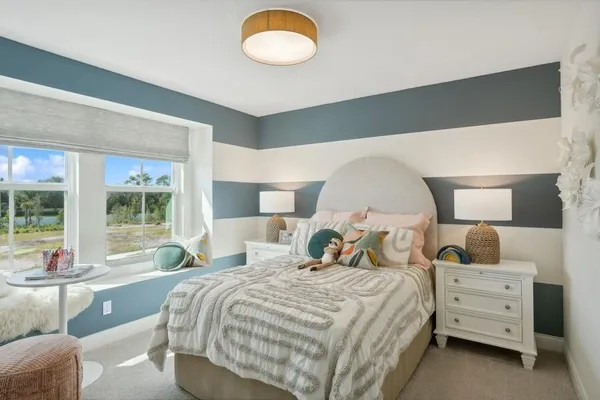 a bed room with a bed and a large window