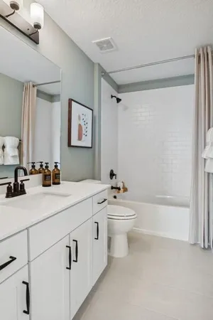 a bathroom with a sink a toilet and a bathtub