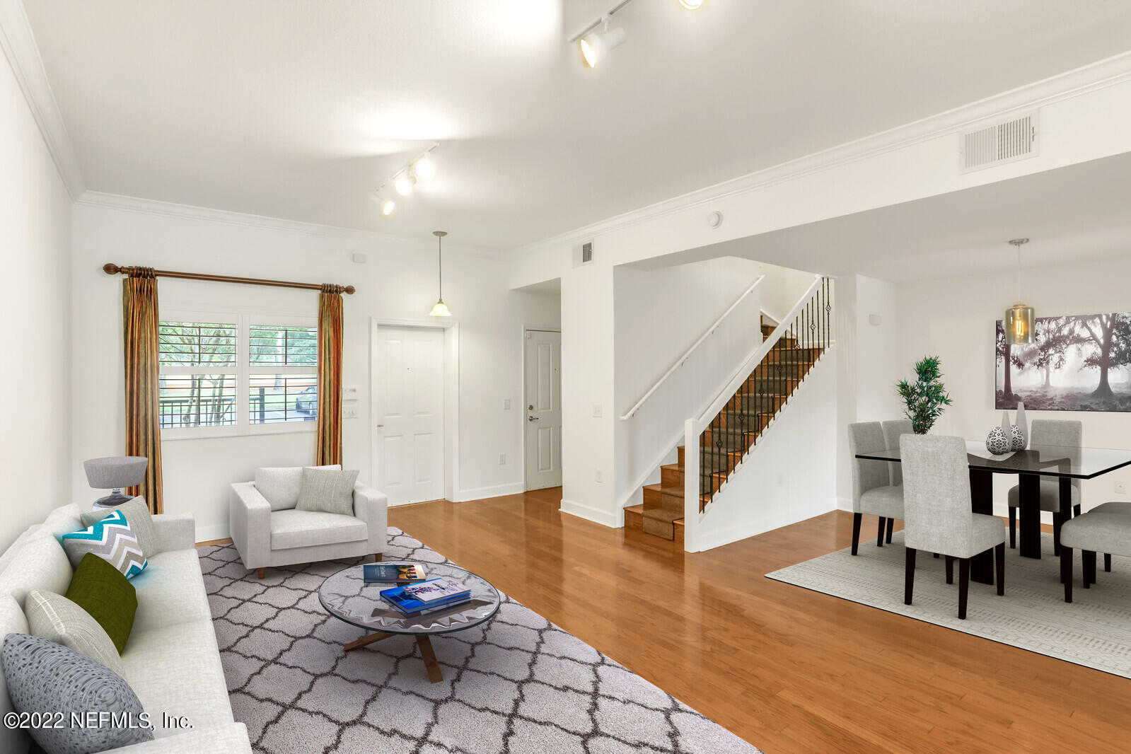 9745 Touchton Road, Unit 2806 Jacksonville, FL 32246 - Photo 11 of 32 a living room with furniture and wooden floor