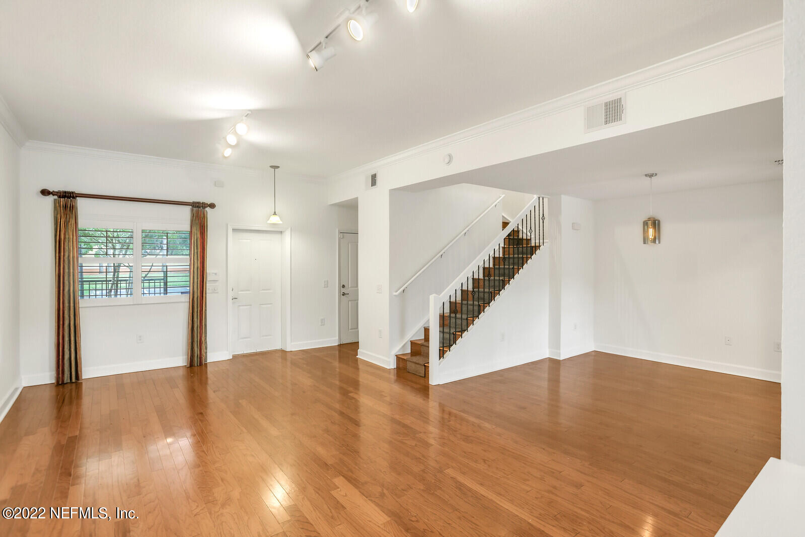 9745 Touchton Road, Unit 2806 Jacksonville, FL 32246 - Photo 12 of 32 a view of entryway and hall with wooden floor