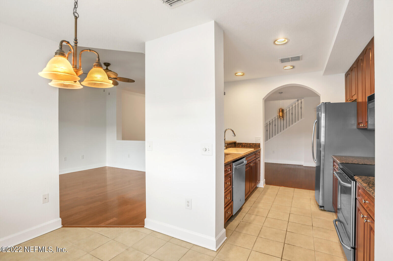 9745 Touchton Road, Unit 2806 Jacksonville, FL 32246 - Photo 19 of 32 a kitchen with stainless steel appliances granite countertop a refrigerator and a sink