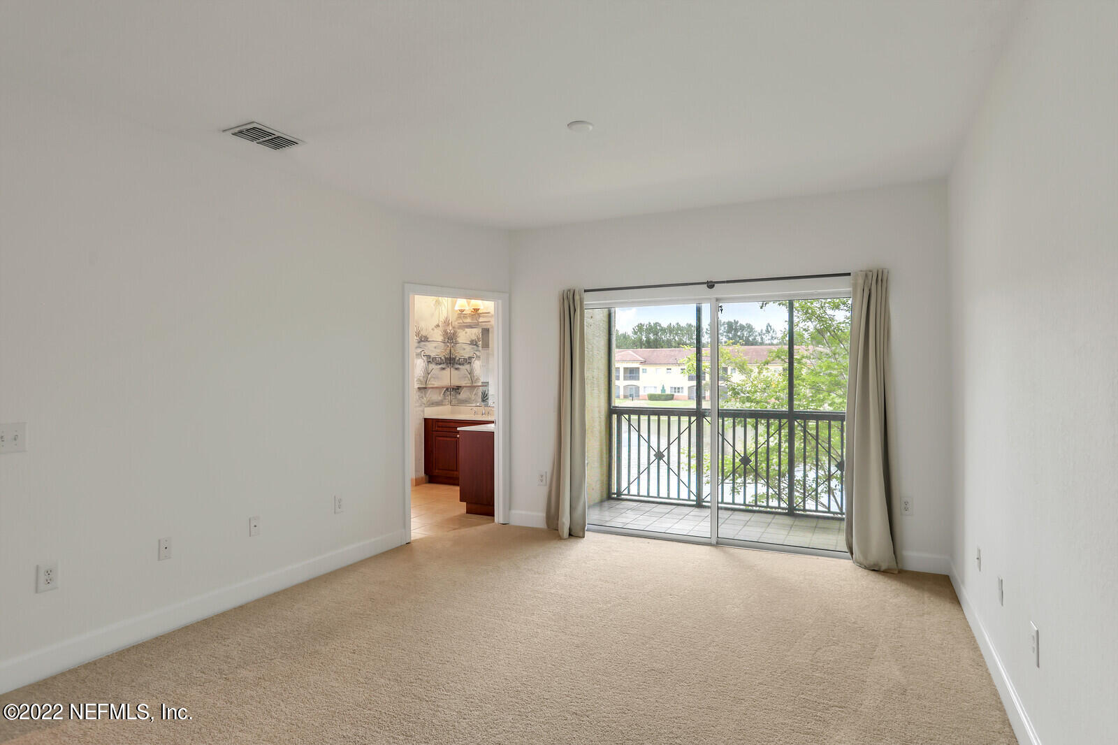 9745 Touchton Road, Unit 2806 Jacksonville, FL 32246 - Photo 25 of 32 a view of an empty room with a window