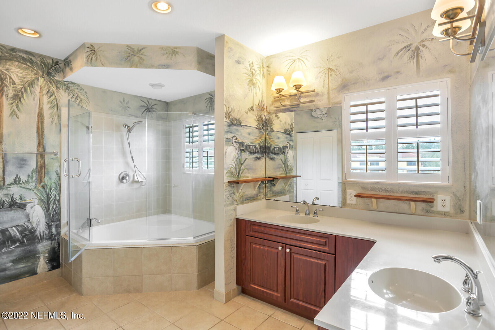 9745 Touchton Road, Unit 2806 Jacksonville, FL 32246 - Photo 27 of 32 a spacious bathroom with a tub sink and mirror