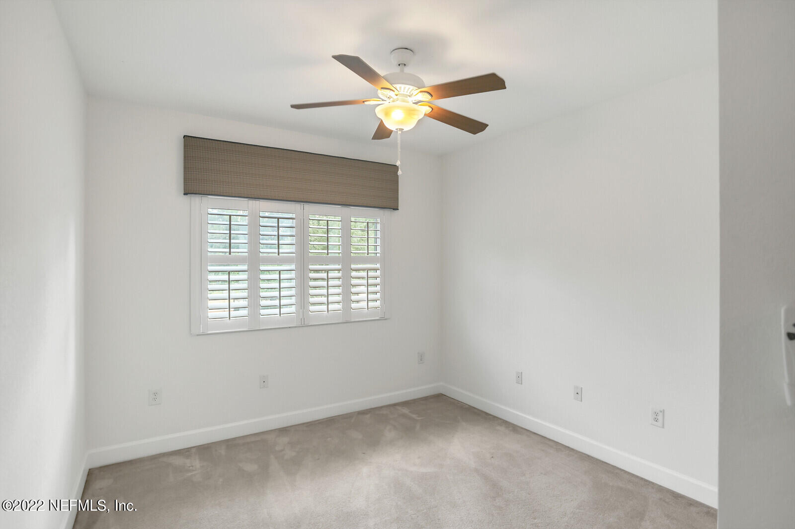 9745 Touchton Road, Unit 2806 Jacksonville, FL 32246 - Photo 30 of 32 an empty room with a window