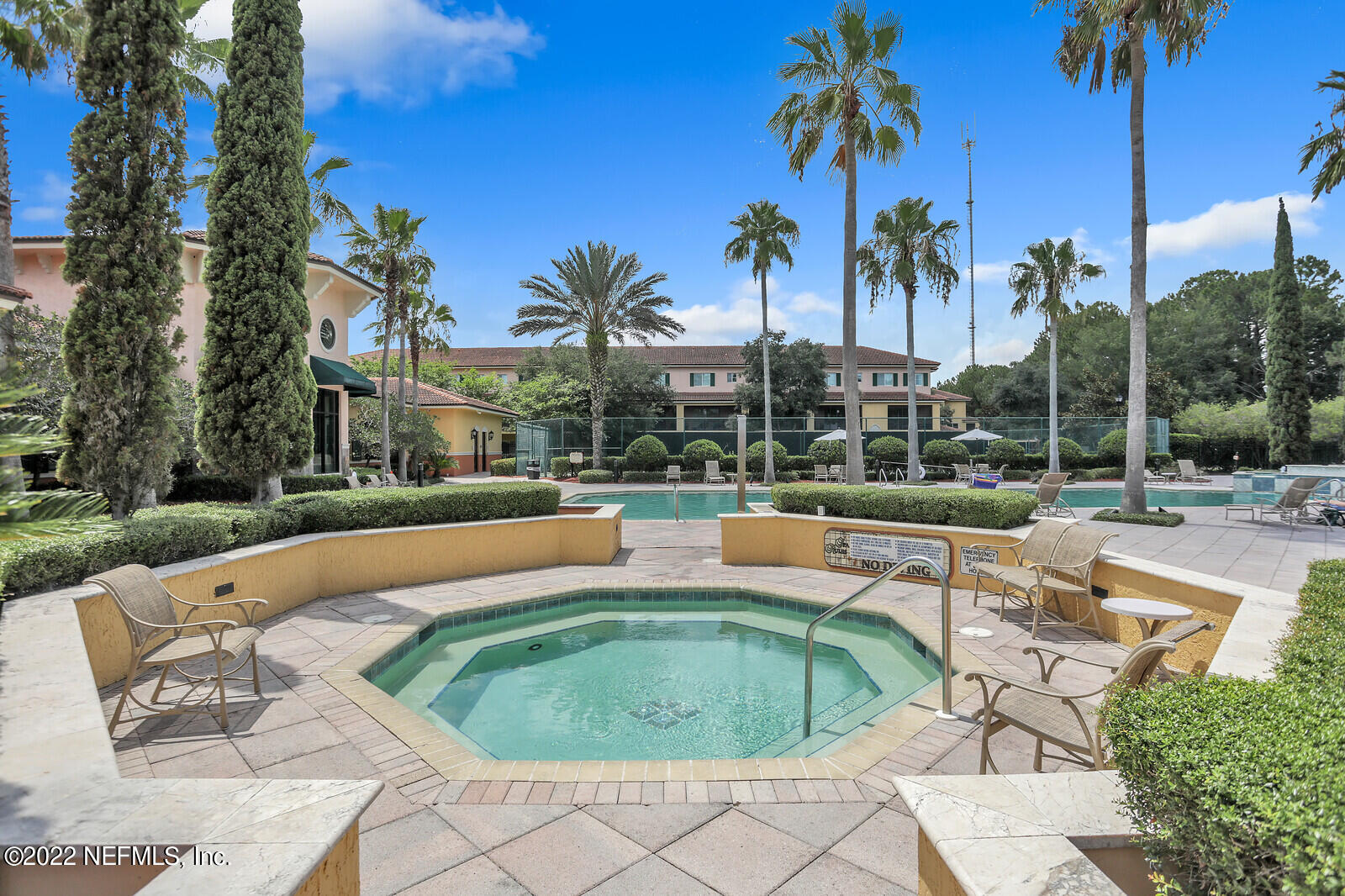 9745 Touchton Road, Unit 2806 Jacksonville, FL 32246 - Photo 5 of 32 a view of swimming pool with outdoor seating and palm tree