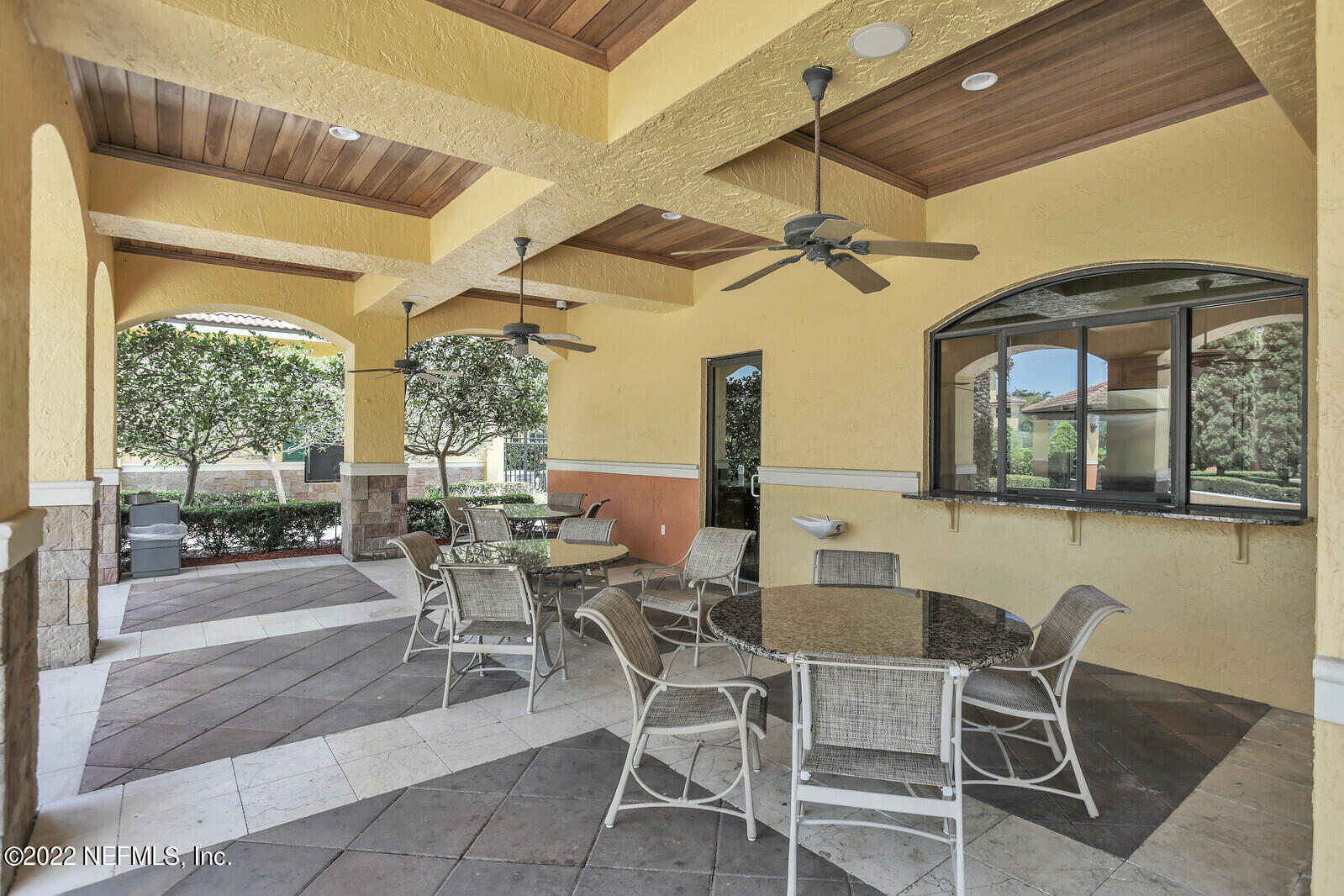 9745 Touchton Road, Unit 2806 Jacksonville, FL 32246 - Photo 6 of 32 a dining room with furniture a chandelier and window