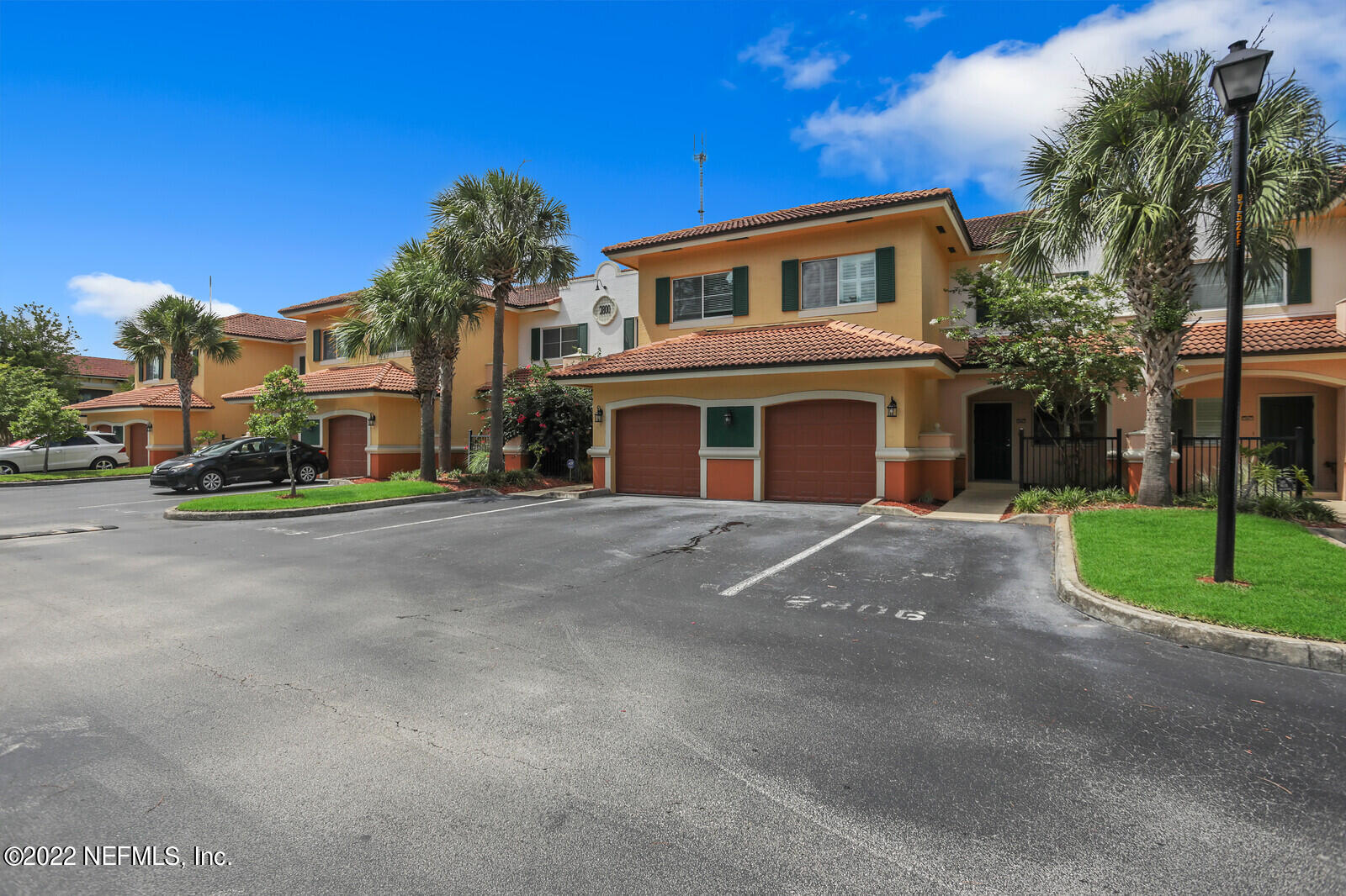 9745 Touchton Road, Unit 2806 Jacksonville, FL 32246 - Photo 7 of 32 a front view of residential houses with yard and road