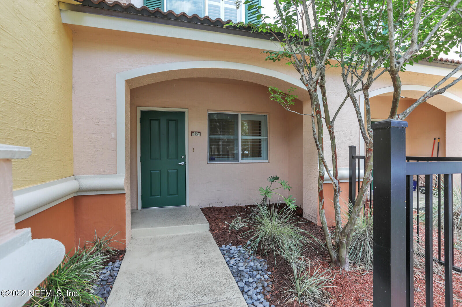 9745 Touchton Road, Unit 2806 Jacksonville, FL 32246 - Photo 8 of 32 a front view of a house with garden