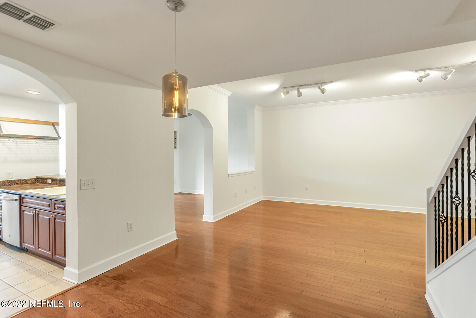 9745 Touchton Road, Unit 2806 Jacksonville, FL 32246 - Photo 10 of 32 a view of empty room with wooden floor and fan