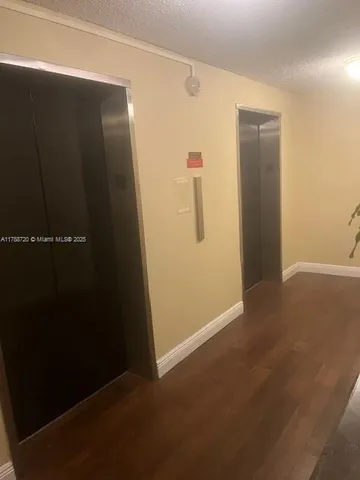 an empty room with wooden floor