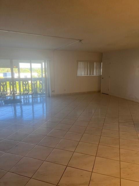 800 Northeast 195th Street, Unit 701 Miami, FL 33179 - Photo 11 of 14 a view of an empty room and window