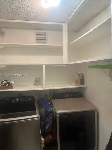 a view of utility room with washer and dryer