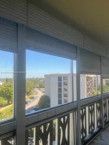 a view of a glass door with a roof deck