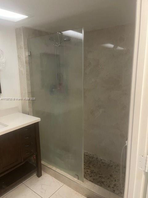 800 Northeast 195th Street, Unit 701 Miami, FL 33179 - Photo 8 of 14 a bathroom with a shower and a sink