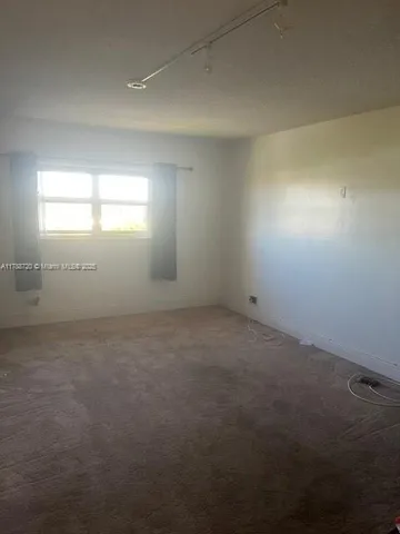 an empty room that has a window