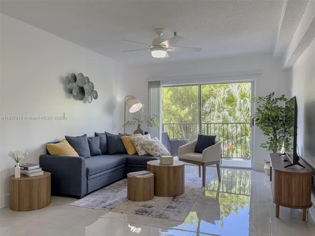 a kitchen with cabinets stainless steel appliances and a window