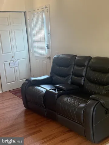 a living room with a couch and a rug