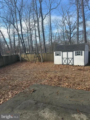 a view of a yard covered with snow in the background