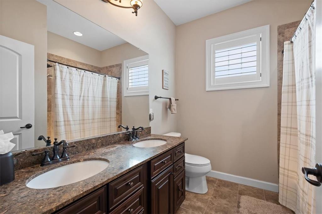200 Durrow Court Mars, PA 16046 - Photo 28 of 50 a bathroom with a granite countertop double vanity sink a mirror and a toilet