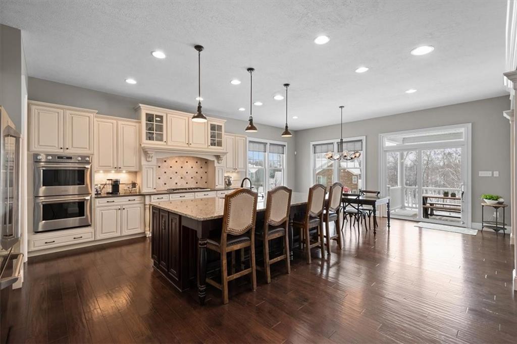 200 Durrow Court Mars, PA 16046 - Photo 4 of 50 a large kitchen with lots of counter space a dining table and chairs