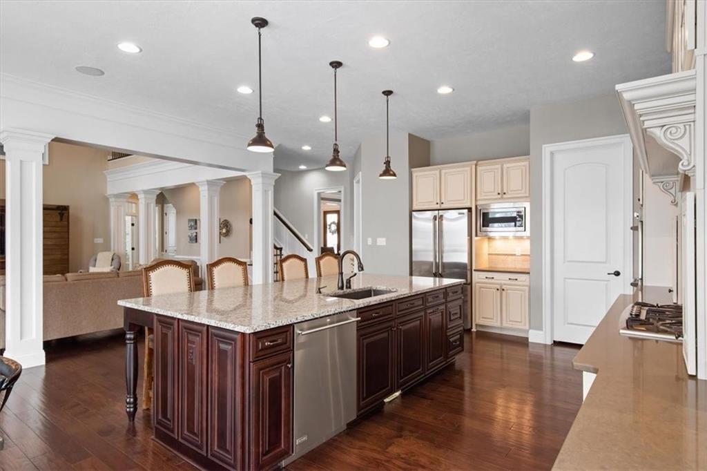 200 Durrow Court Mars, PA 16046 - Photo 7 of 50 a kitchen with stainless steel appliances granite countertop a kitchen island a stove and a sink