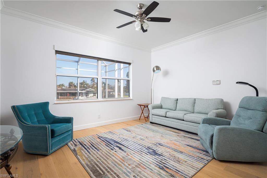 451 Oak Avenue Naples, FL 34108 - Photo 16 of 25 a living room with furniture and a window