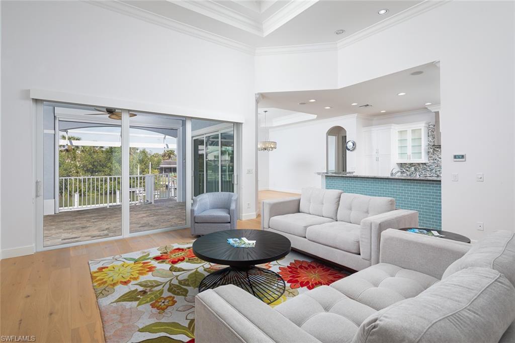 451 Oak Avenue Naples, FL 34108 - Photo 4 of 25 a living room with furniture and a table
