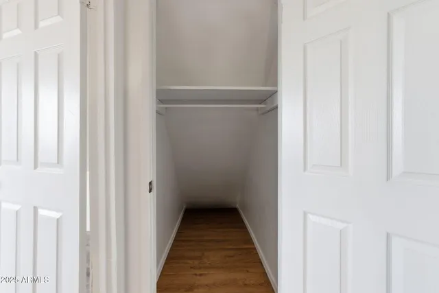 a view of a closet with white door