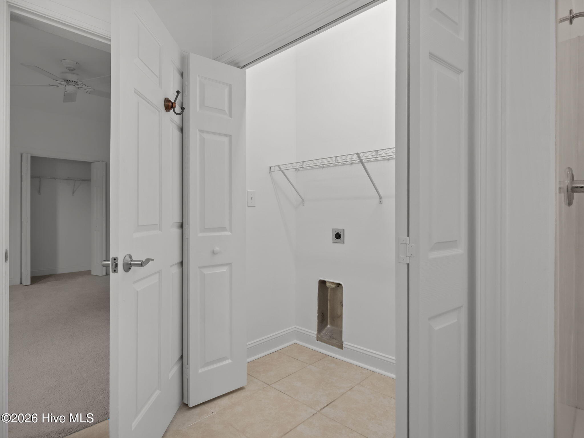 200 Lighthouse Lane, Unit A1 Cedar Point, NC 28584 - Photo 11 of 33 LAUNDRY CLOSET IN MASTER BATHROOM