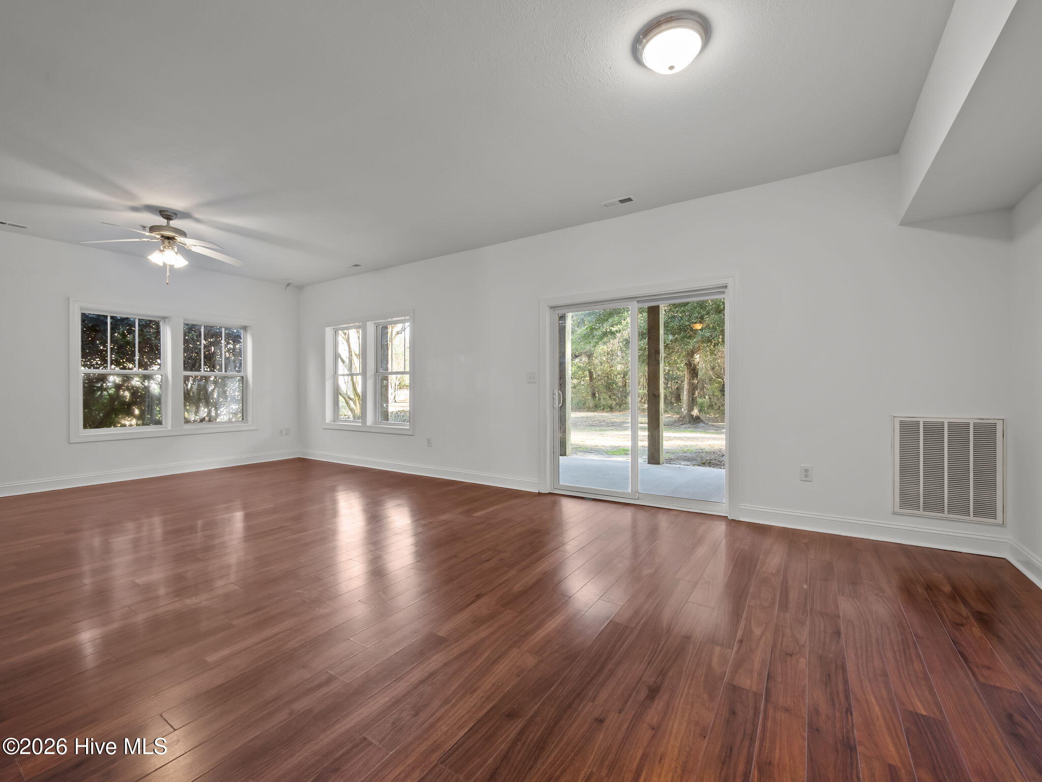 200 Lighthouse Lane, Unit A1 Cedar Point, NC 28584 - Photo 12 of 34 LIVING ROOM TO BACK PATIO/YARD