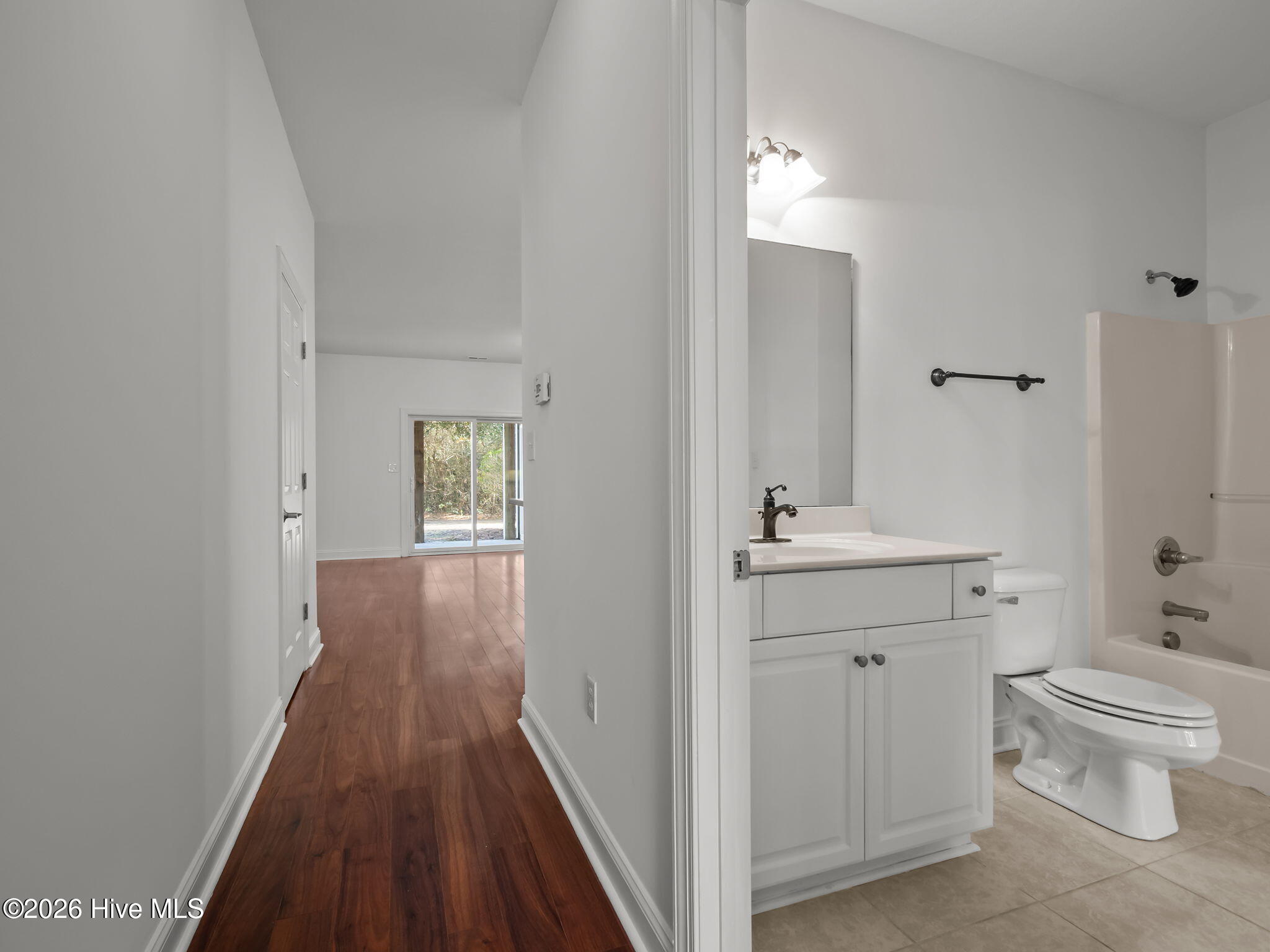 200 Lighthouse Lane, Unit A1 Cedar Point, NC 28584 - Photo 5 of 34 HALLWAY AT ENTRY TO SLIDING DOOR